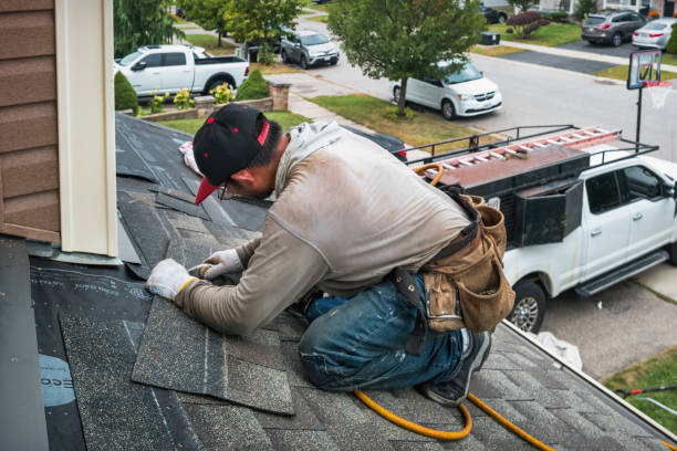 Professional Roofing technician working in Saint John Fisher College, NY